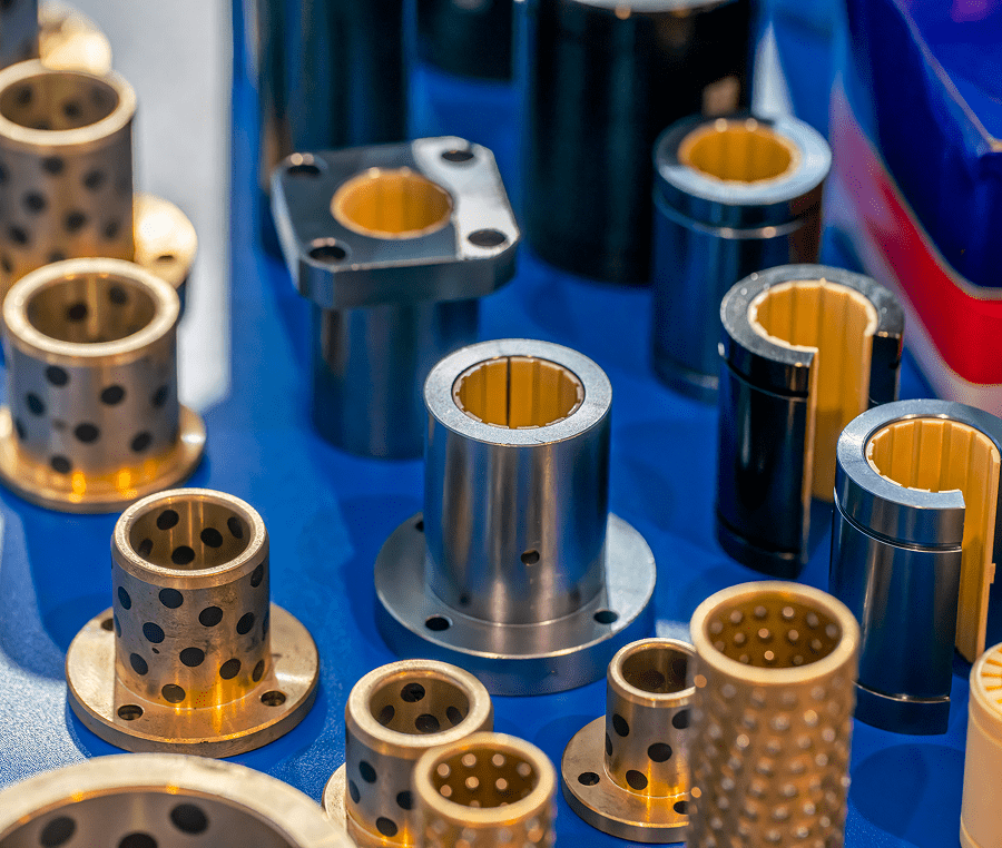 Various industrial bushings on display table.